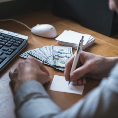 Businessman is counting dollars banknotes, business and financial background